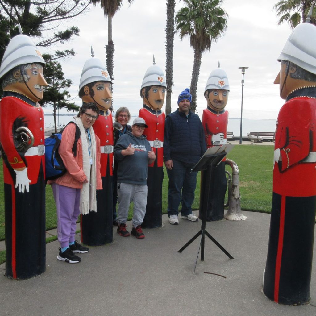 A supported group travelling to see the sculptures in Geelong, Victoria, with Leisure Options.